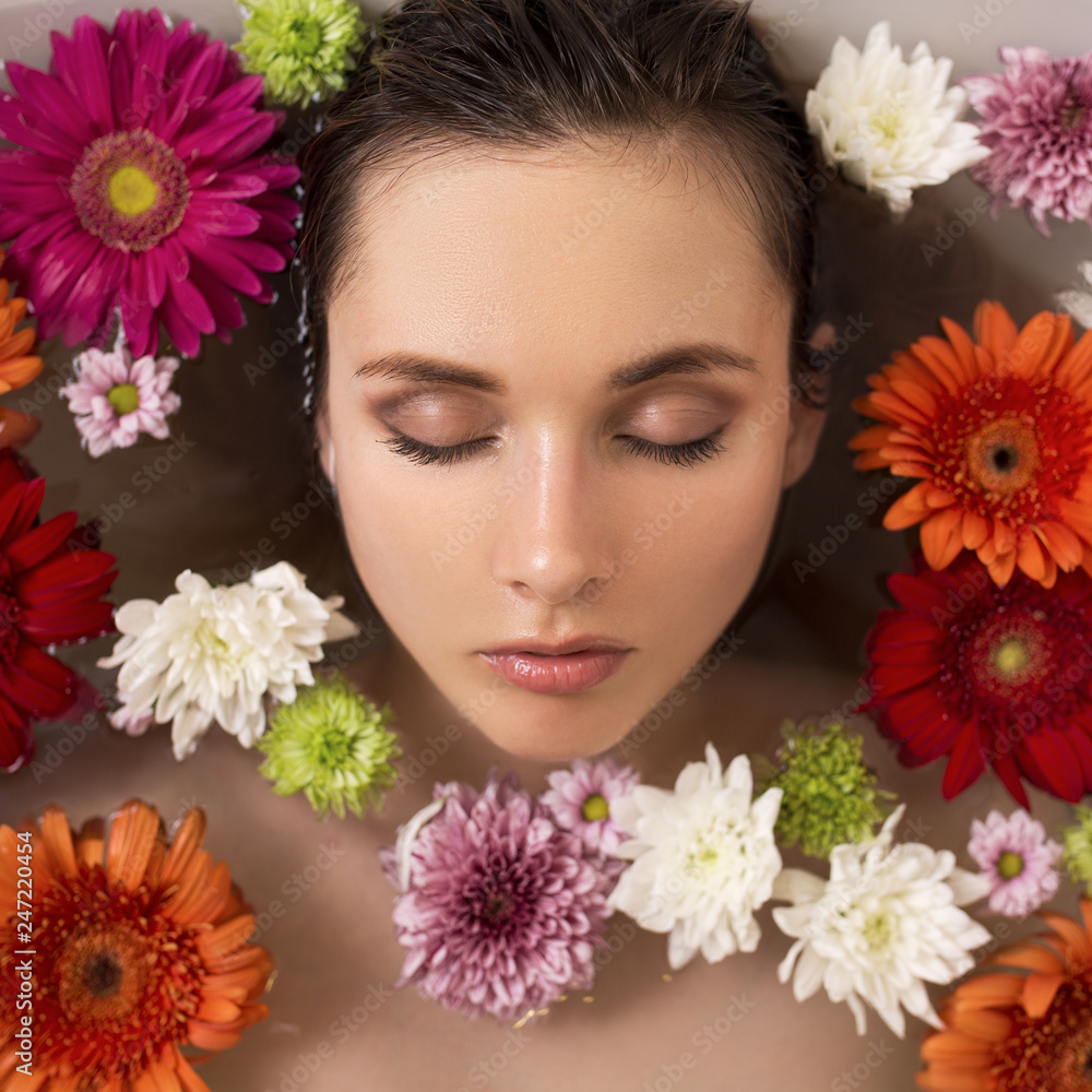Woman relaxing in flower bath. Spa and beauty. Woman relaxing in flower bath. Spa and beauty.