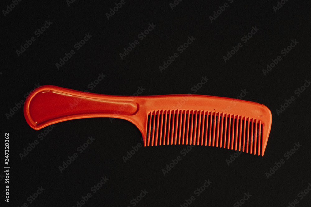 red hairbrush on a black background subject background red hairbrush on a black background subject background
