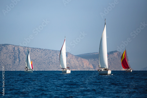 Adventure and luxury holiday. Sailing boats in the sail yacht regatta at Aegean Sea.