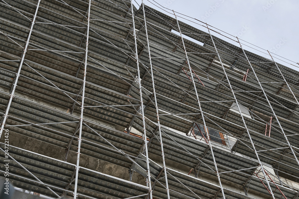 new building under construction, scaffolding and concrete