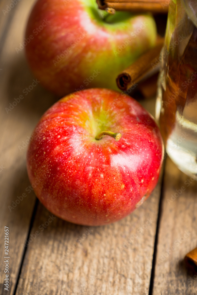 Apples with cinnamon on rustic wooden background. Selective focus. Apples with cinnamon on rustic wooden background. Selective focus.