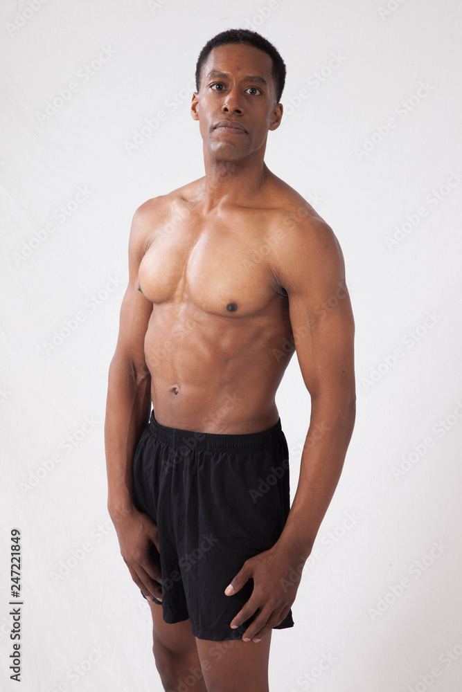 Strong Black man flexing muscles Strong Black man flexing muscles