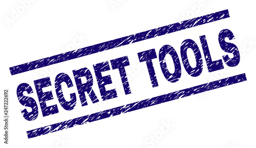 SECRET TOOLS seal print with scratced style. Blue vector rubber print of SECRET TOOLS title with unclean texture. Text title is placed between parallel lines.