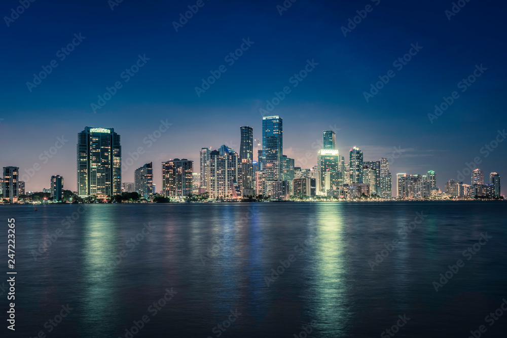 Miami city downtown at night in South Florida. Blue tone