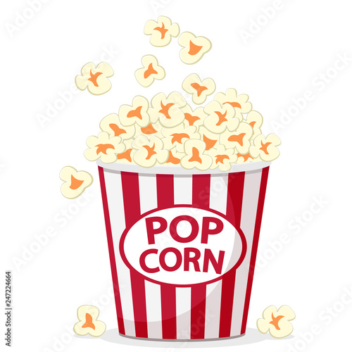 Popcorn flies in a full bucket on a white.