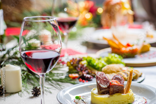 festive served table with food and glasses of wine