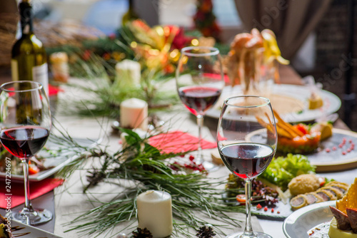 festive served table with food and glasses of wine