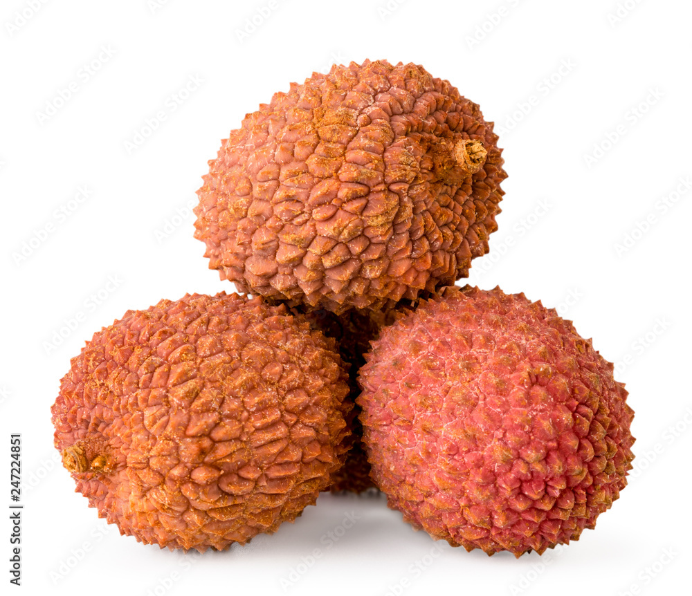 Heap of ripe lychees close up on a white. Isolated. Heap of ripe lychees close up on a white. Isolated.