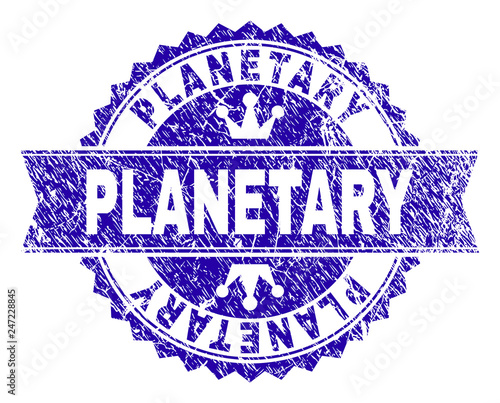 PLANETARY rosette seal imitation with grunge style. Designed with round rosette, ribbon and small crowns. Blue vector rubber print of PLANETARY tag with grunge style.