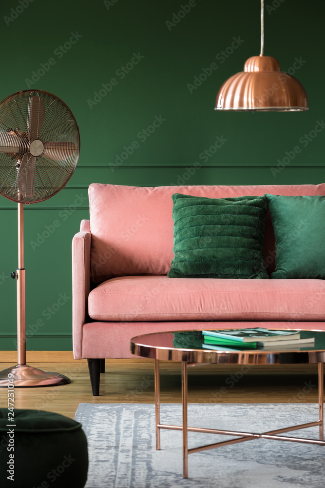 Copper accents in elegant pastel pink and emerald green interior with