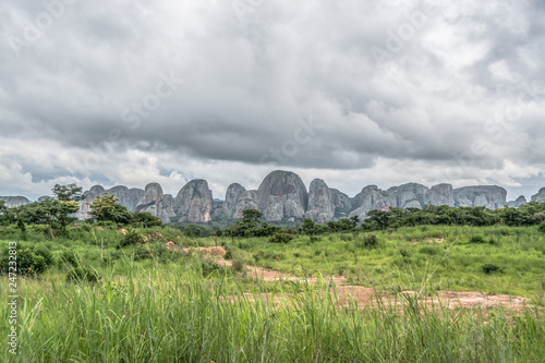 View of a tropical landscape, with forest and mountains Pungo Andongo, Pedras Negras , black stones, huge geologic rock elements photo