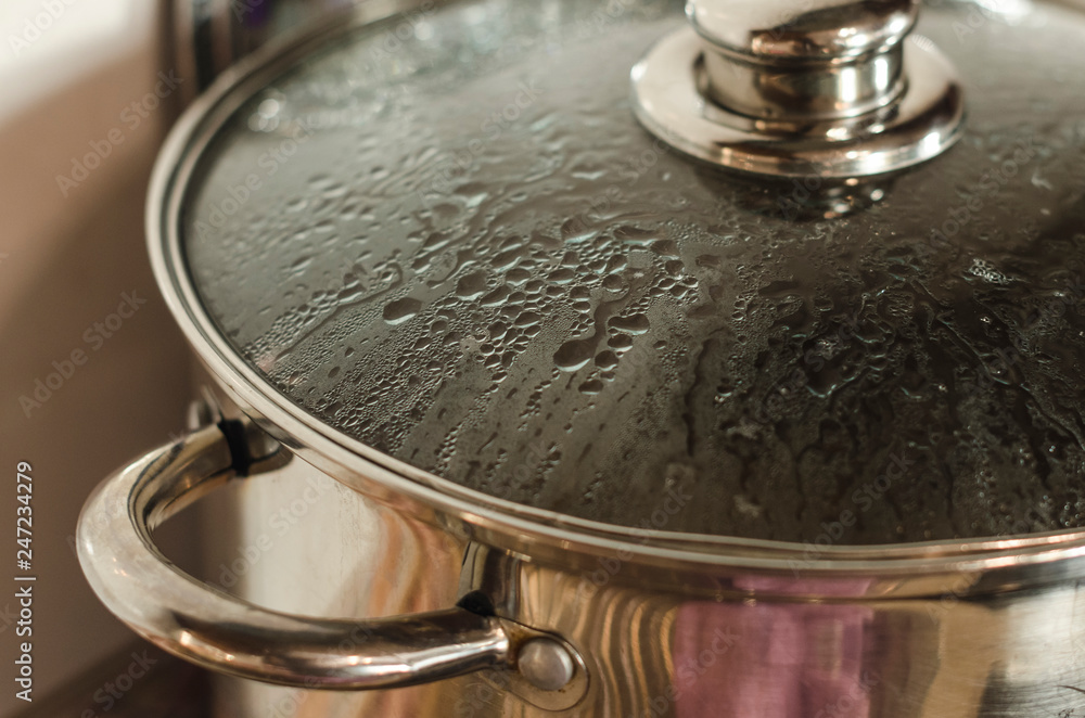 Kitchen pan with lid on the stove Kitchen pan with lid on the stove
