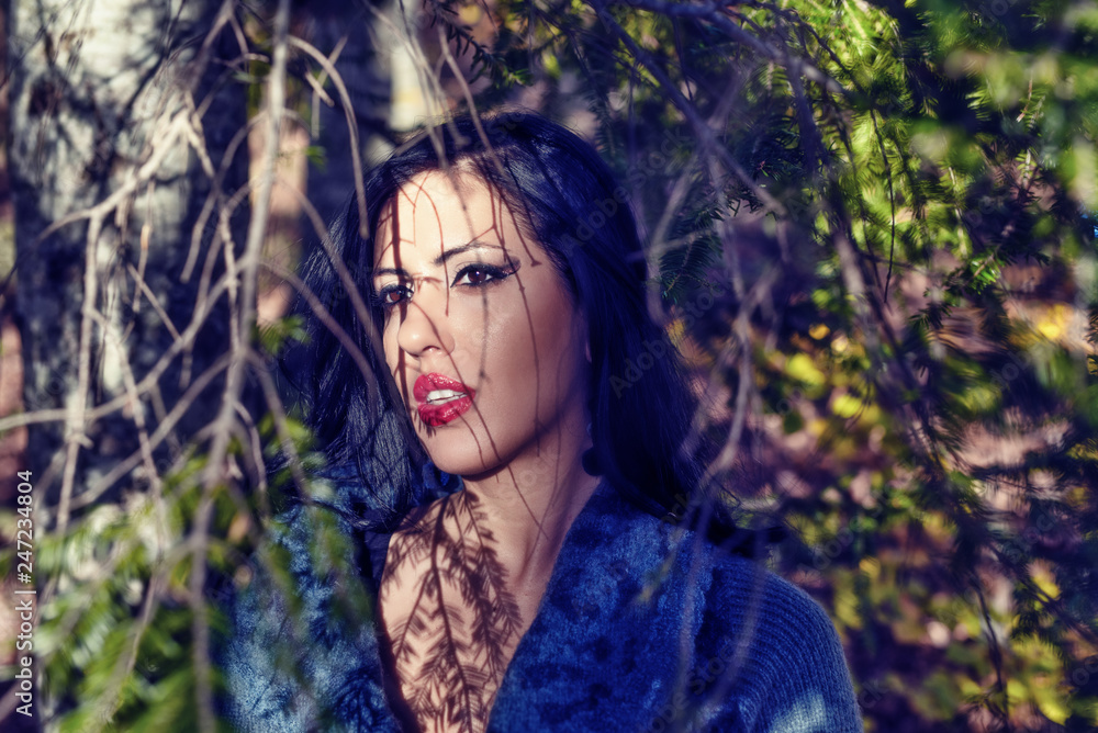 Portrait of young woman in a forest Portrait of young woman in a forest