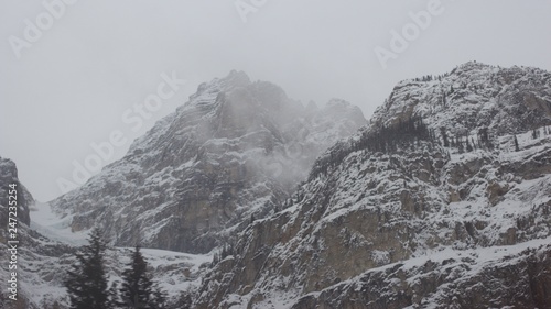 Pair of rugged mountain peaks in stormy conditions © Calen
