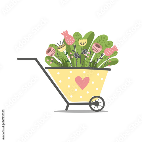 Beautiful spring flowers in a wheel barrow.