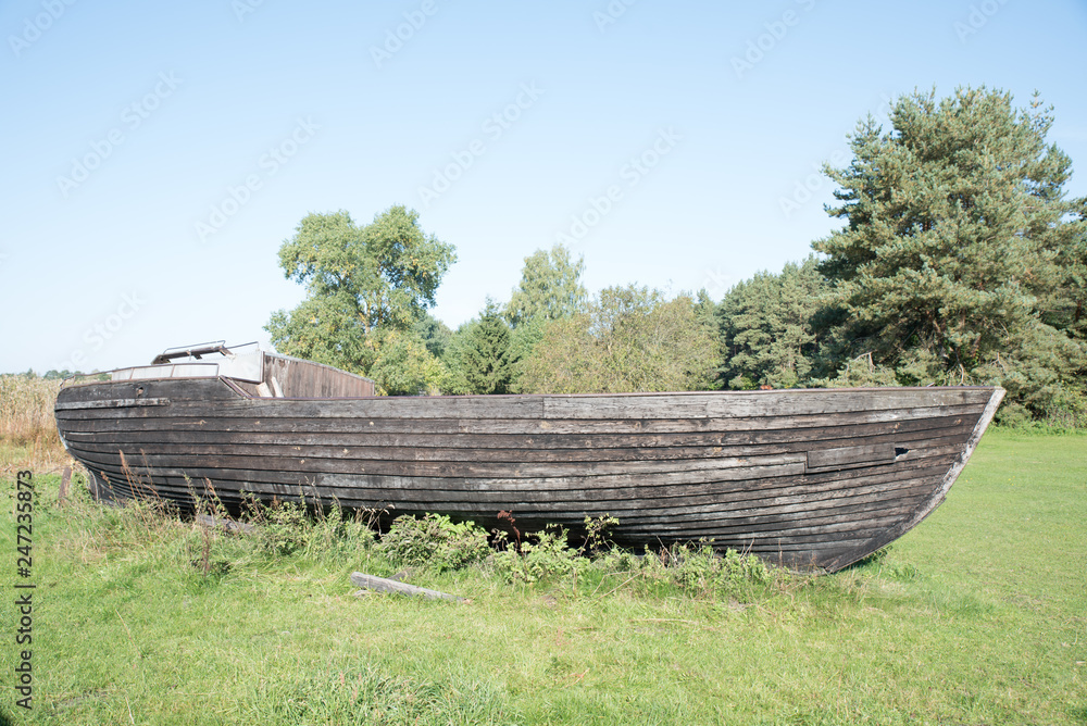 An Old Wooden Fishing Boat in Garden As Decoration Item Stock