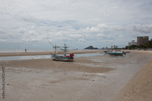 Fishing boats at the beach of Hua HI on a cloudy day, THailand