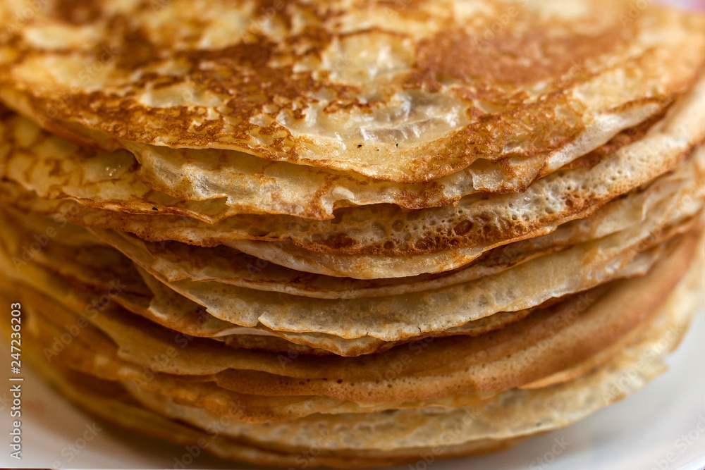 Thin pancakes with crispy crust. Maslenitsa. Pancakes for breakfast and carnival.