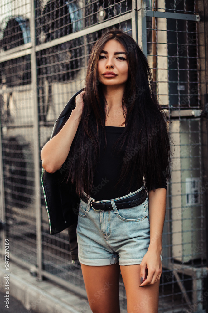 Naklejka premium Pretty young sexy fashion woman posing on ventilators background.