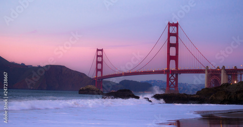 Sunset over the Golden Gate Bridge at Baker Beach in San Francisco, California