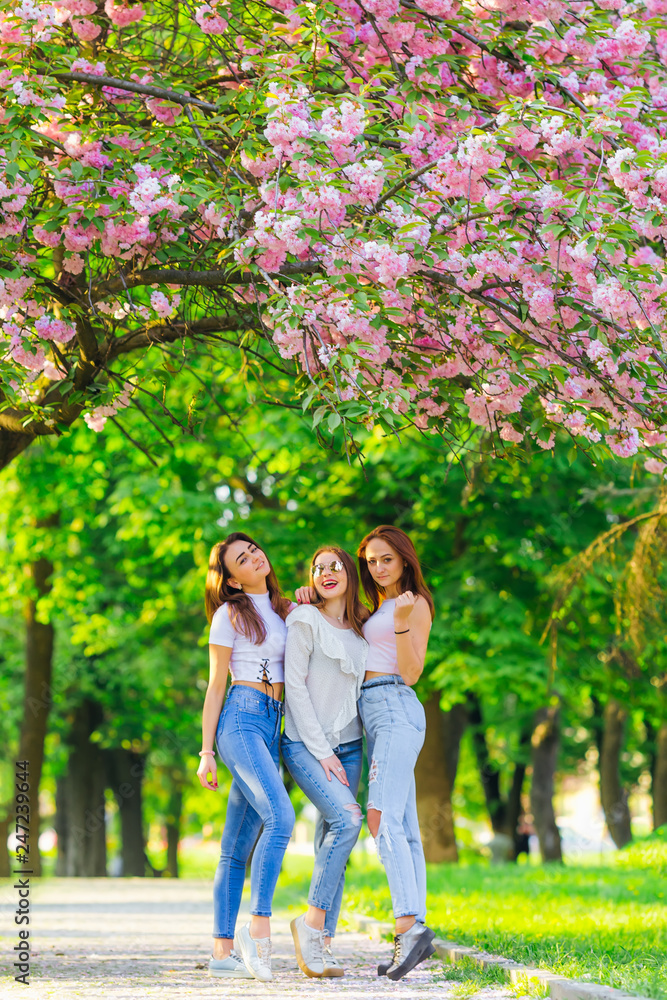 Fototapeta premium pretty girls having fun. best friend in spring garden