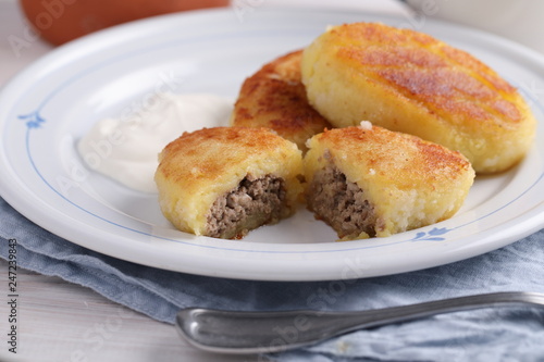 Potato meat filling patties with sour cream