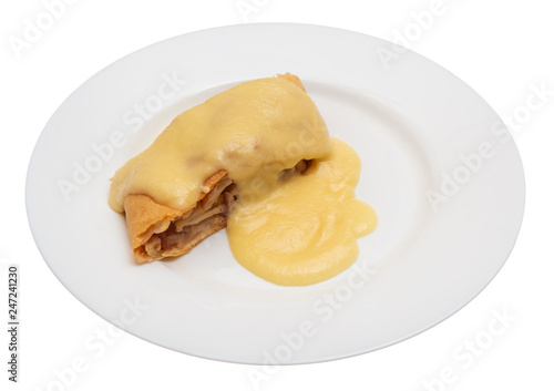 A piece of delicious apple strudel with sweet sauce on white plate