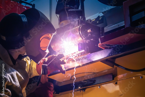 The welder does the work. A...