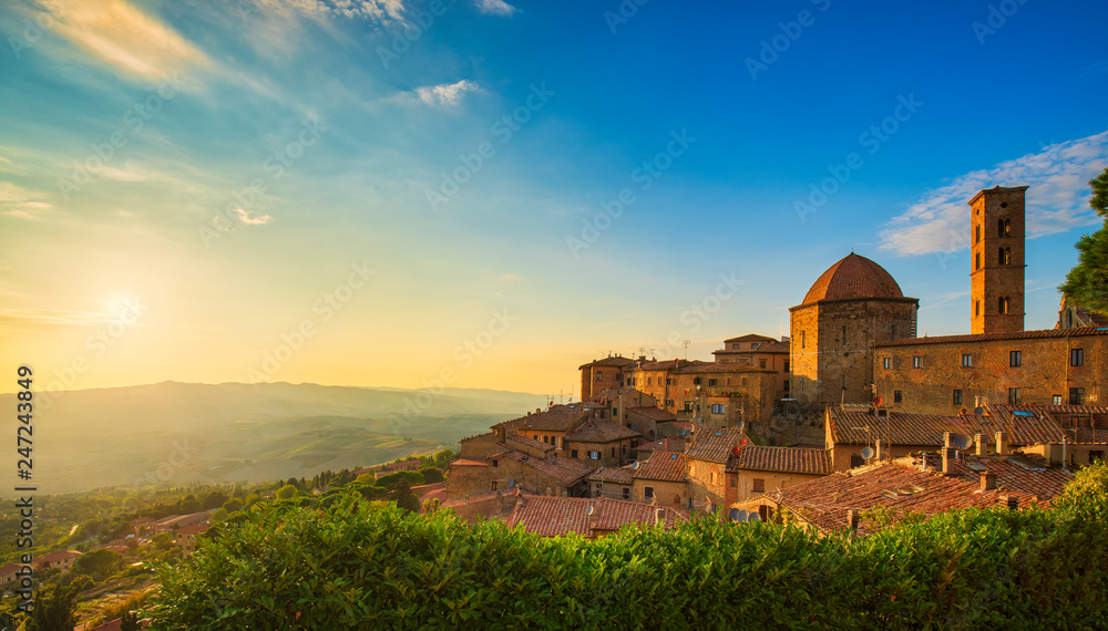 Tuscany, Volterra town skyline, church and panorama view on sunset. Italy Tuscany, Volterra town skyline, church and panorama view on sunset. Italy