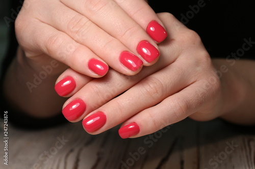 Stylish manicure nails on a beautiful textural background