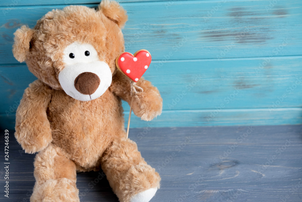 Toy bear with a heart. The basis for the greeting card. Preparation for a romantic card with bears and hearts. Valentine card