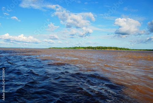 Meeting of Waters. Manaus, Amazonas, Brazil. Rio Negro river and its beauties that enchant to all visitors. Amazonia, the living nature. 