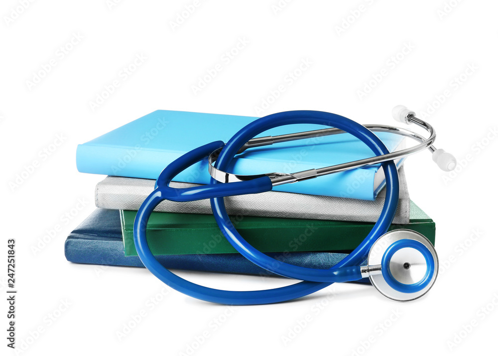 Stack of student textbooks and stethoscope on white background. Medical ...