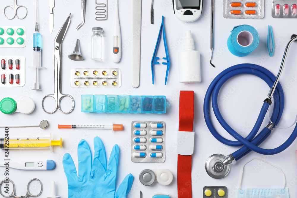 Flat lay composition with medical objects on white background