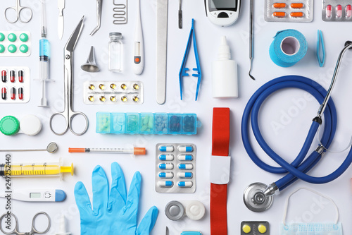 Flat lay composition with medical objects on white background