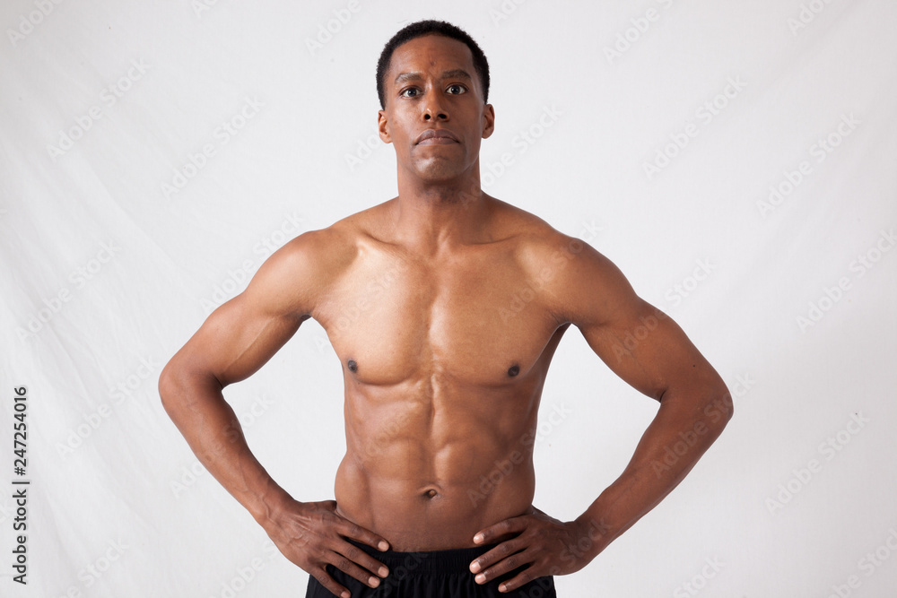 Strong black man with hands on hips