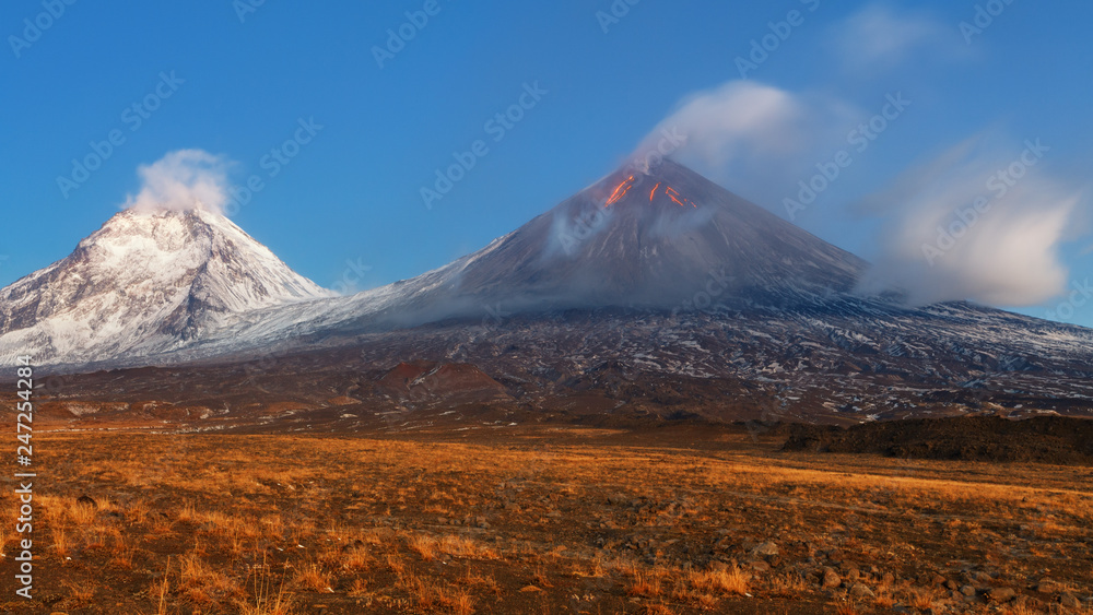 Autumn mountain landscape view at sunrise of eruption active volcano Autumn mountain landscape view at sunrise of eruption active volcano
