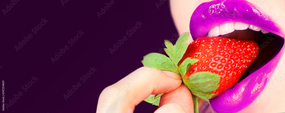 Obraz premium Women's lips with strawberries. The concept of sex, erotica. Toned image, selective focus.