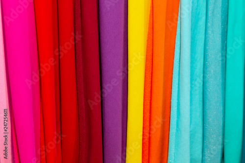 Colorful fabrics on the counter of the store. Sale