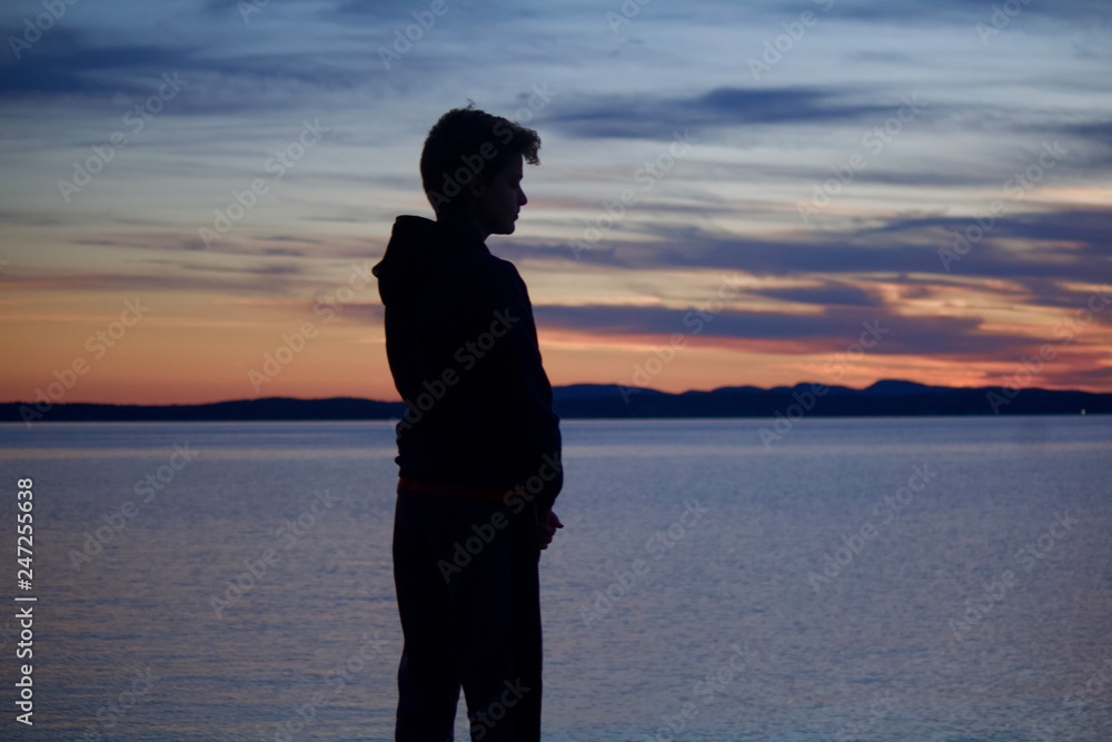 silhouette of boy at sunset silhouette of boy at sunset