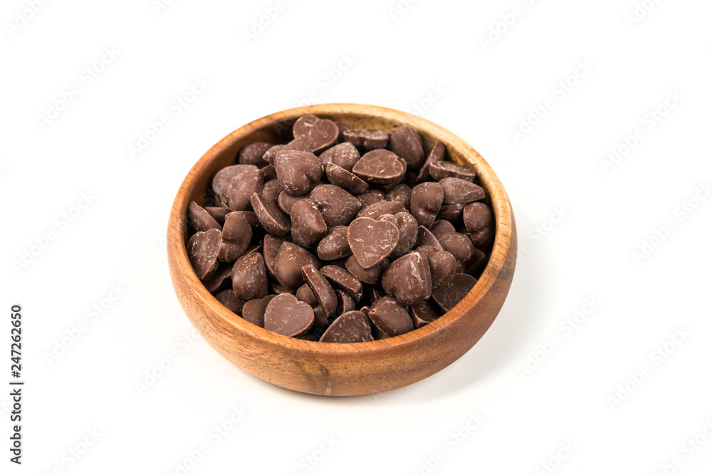 Fototapeta premium Brown candy heart shaped milk chocolate chip pieces