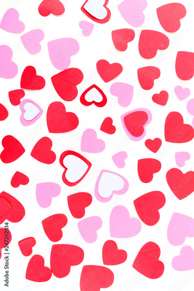 Multicolored red white and pink valentine heart shapes isolated over white