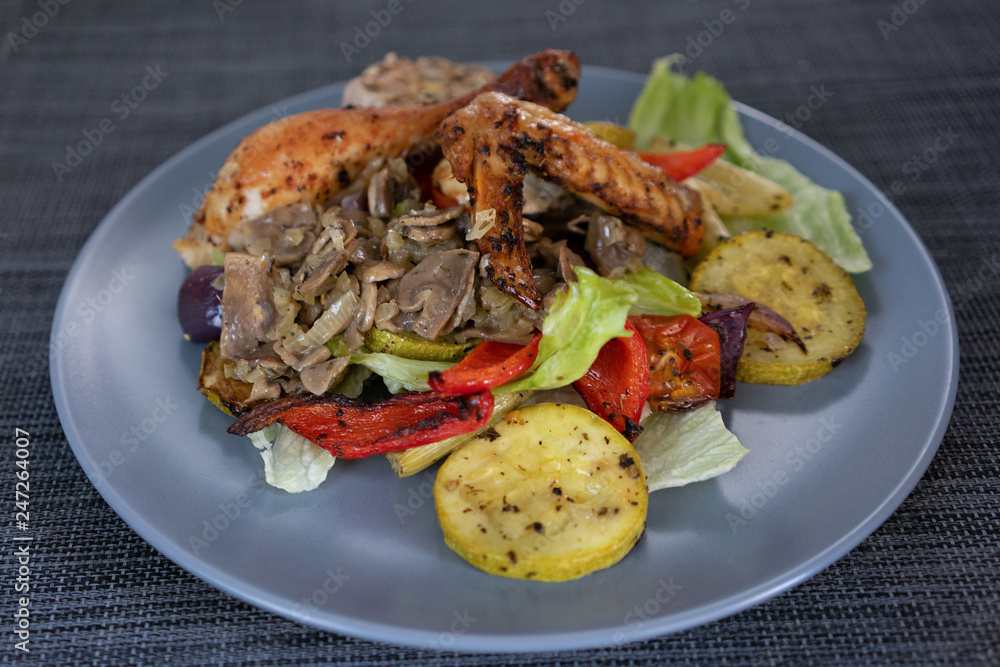 Baked chicken with herbs and vegetable salad
