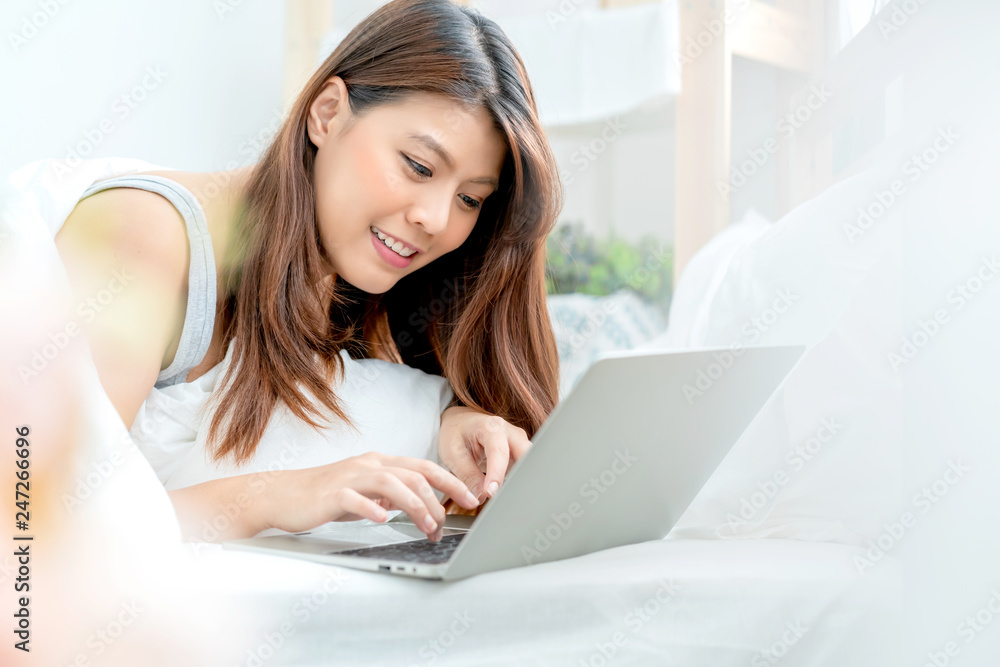 beautiful smiling asian woman enjoy happiness working at home successful positive thinking white bedroom background beautiful smiling asian woman enjoy happiness working at home successful positive thinking white bedroom background