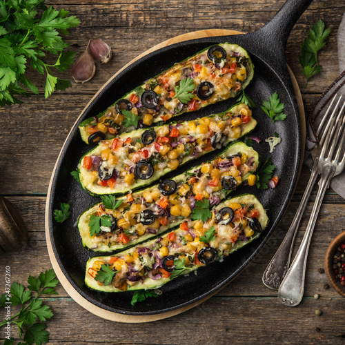 Wallpaper Mural Stuffed zucchini boats with vegetables ( tomato, pepper, corn, red onion and olives) and cheese in cast iron pan Torontodigital.ca
