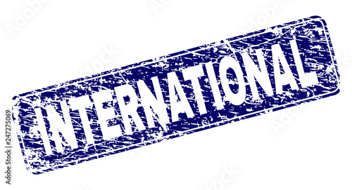 INTERNATIONAL stamp seal watermark with grunge texture. Seal shape is a rounded rectangle with frame. Blue vector rubber print of INTERNATIONAL label with grunge texture.