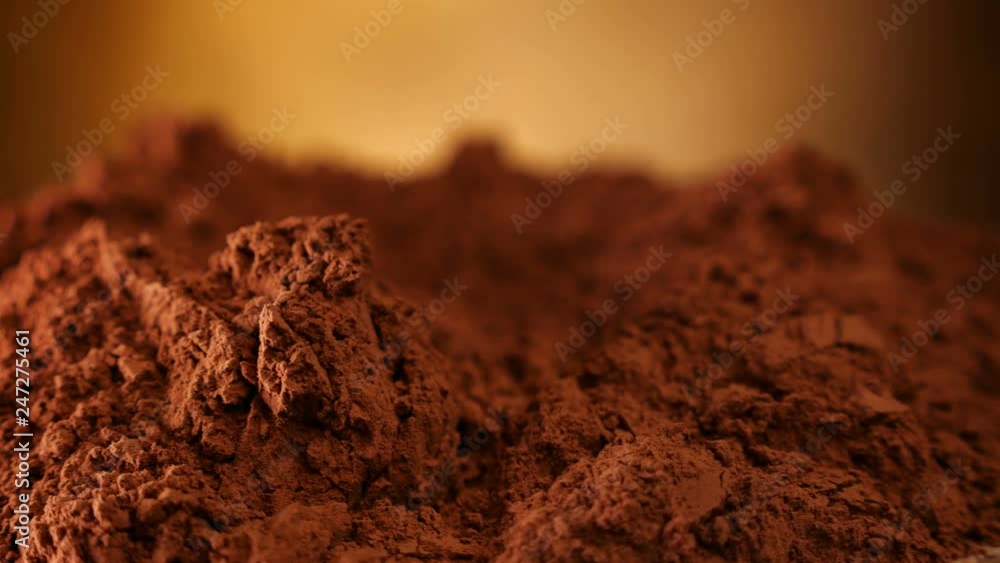Cocoa powder heap rotate in front of camera - close up Cocoa powder heap rotate in front of camera - close up