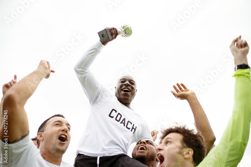 Football players celebrating their victory