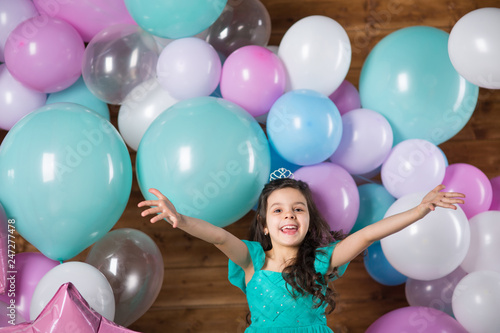 Girl child with balloons