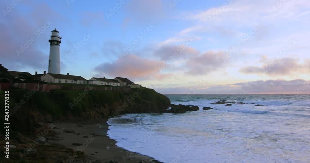 Pastel colors of sunset and waves crashing by Pigeon Pight Lightouse on Northern California Pacific Ocean coastline at Pigeon Point lighthouse in Northern California at sunset Pastel colors of sunset and waves crashing by Pigeon Pight Lightouse on Northern California Pacific Ocean coastline at Pigeon Point lighthouse in Northern California at sunset